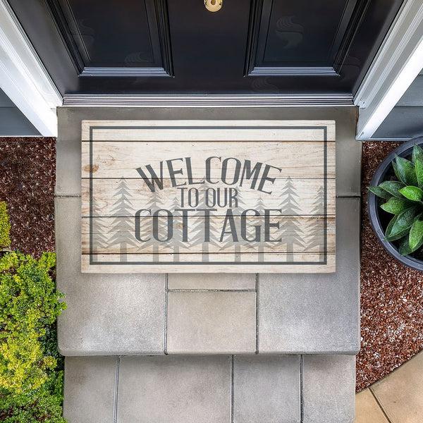 Stupell Industries Kim Allen | Rustic Welcome Cottage Trees Non-Woven Door Mat