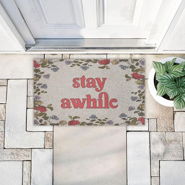 Stupell Industries Stupell Studio | Stay Awhile Inviting Florals Faux Sisal Door Mat